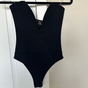 Black Strapless Body suit with a deep V